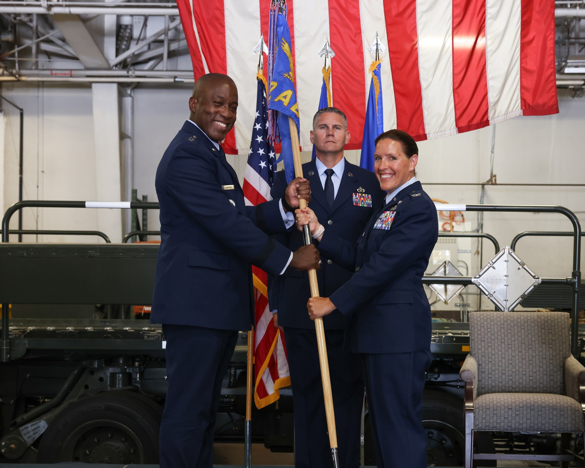 Man and woman holding flag for photo