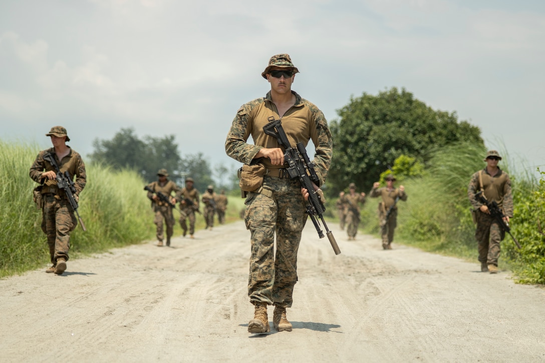 U.S. Marines with 3d Littoral Combat Team, 3d Marine Littoral Regiment, 3d Marine Division, conduct a security patrol during Marine Aviation Support Activity 23 at Naval Education, Training and Doctrine Command, Philippines, July 11, 2023. MASA is a bilateral exercise between the Armed Forces of the Philippines and the U.S. Marine Corps, aimed at enhancing interoperability and coordination focused on aviation-related capabilities. During MASA 23, Armed Forces of the Philippines and U.S. Marines conduct approximately twenty different training evolutions, including live-fire, air assaults, and subject matter expert exchanges across aviation, ground, and logistics capabilities.