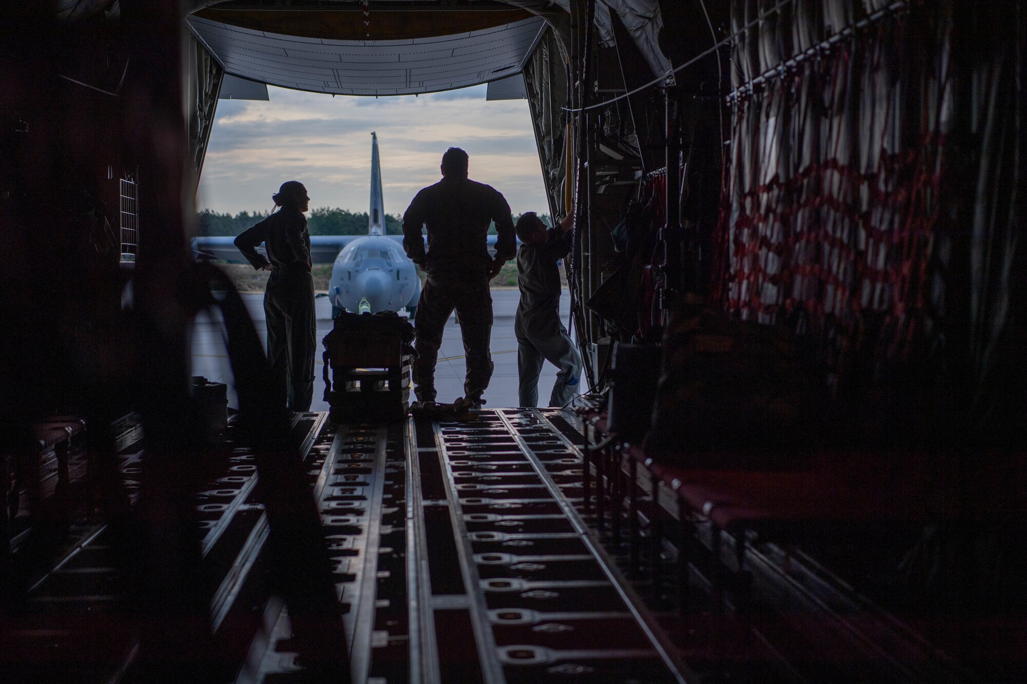 U.S. Air Force loadmasters with U.S. Air Forces in Europe - Air Forces Africa, the 86th Operations Support Squadron, and the 37th Airlift Squadron prepare a C-130J Super Hercules aircraft for a NATO interfly flight at Ramstein Air Base, Germany, July 14, 2023.