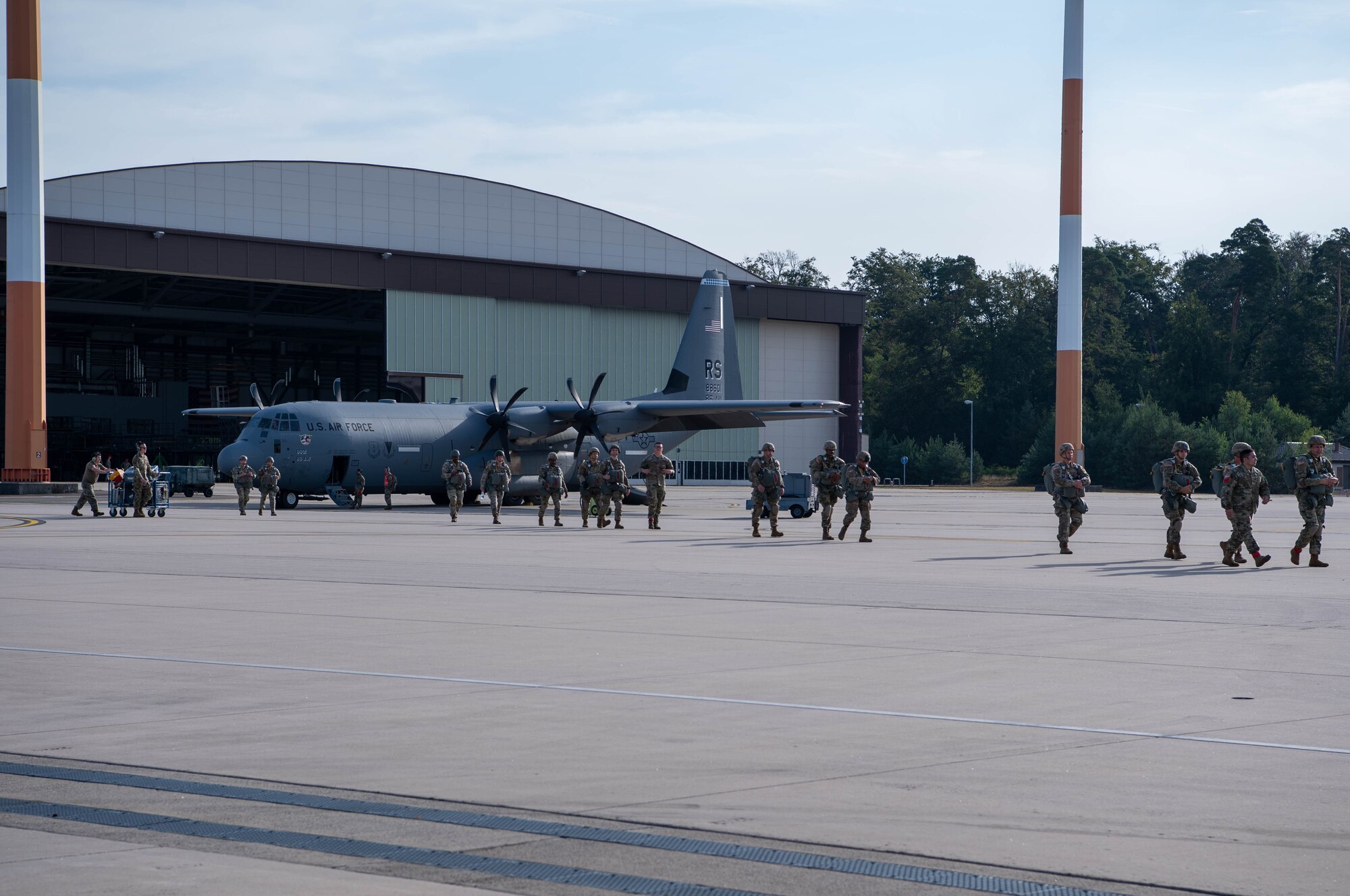 U.S. Army soldiers from the 91st Cavalry Regiment, U.S. Army Garrison Bavaria Tower Barracks Grafenwohr, Germany, walk to a U.S. Air Force C-130J Super Hercules aircraft, assigned to the 37th Airlift Squadron at Ramstein Air Base, Germany, at Ramstein AB, July 14, 2023.