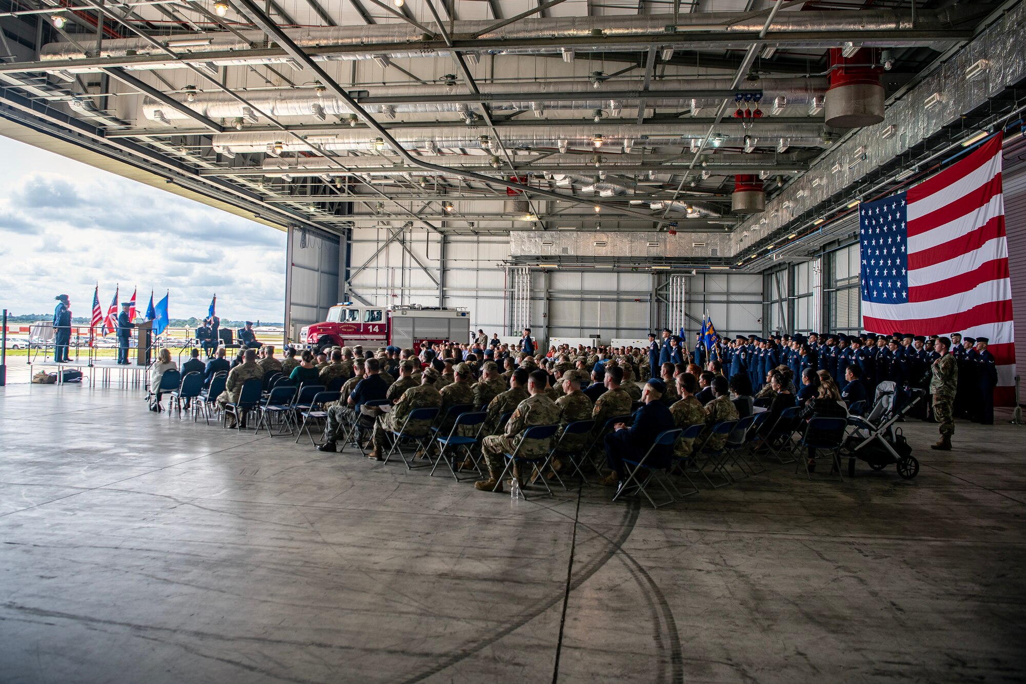 U.S. Air Force Col. Dennis Phillips, 501st Combat Support Wing commander, speaks during a change of command ceremony at RAF Fairford, England, July 18, 2023. The change of command ceremony signifies the transition of responsibility and command from one party to another. (U.S. Air Force photo by Staff Sgt. Eugene Oliver)
