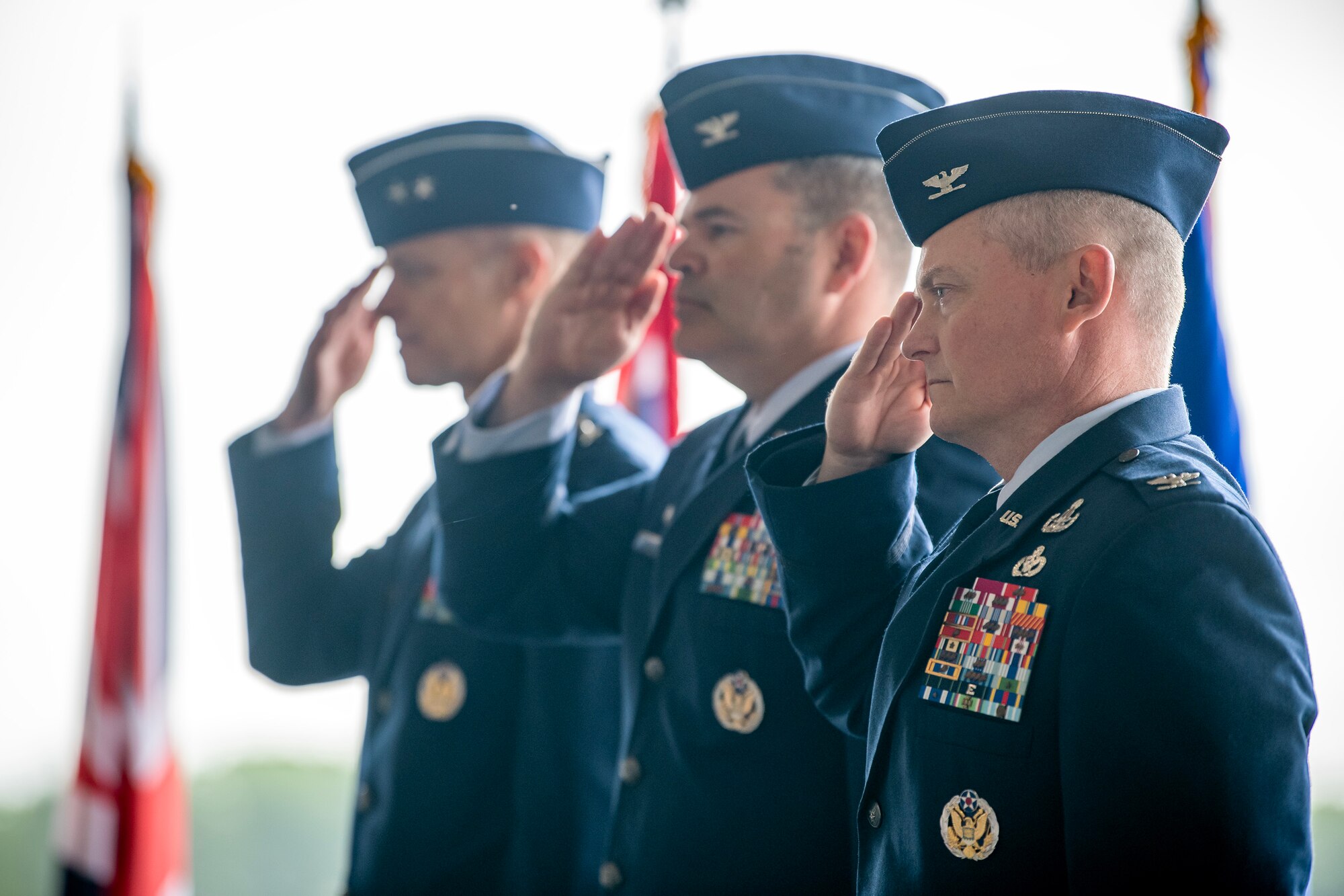 U.S. Air Force Maj. Gen. Derek France, left, Third Air Force commander, Col. Brian Filler, center, outgoing 501st Combat Support Wing commander, and Col. Dennis Phillips, right, incoming 501st CSW commander, salute during a change of command ceremony at RAF Fairford, England, July 18, 2023. The change of command ceremony signifies the transition of responsibility and command from one party to another. (U.S. Air Force photo by Staff Sgt. Eugene Oliver)
