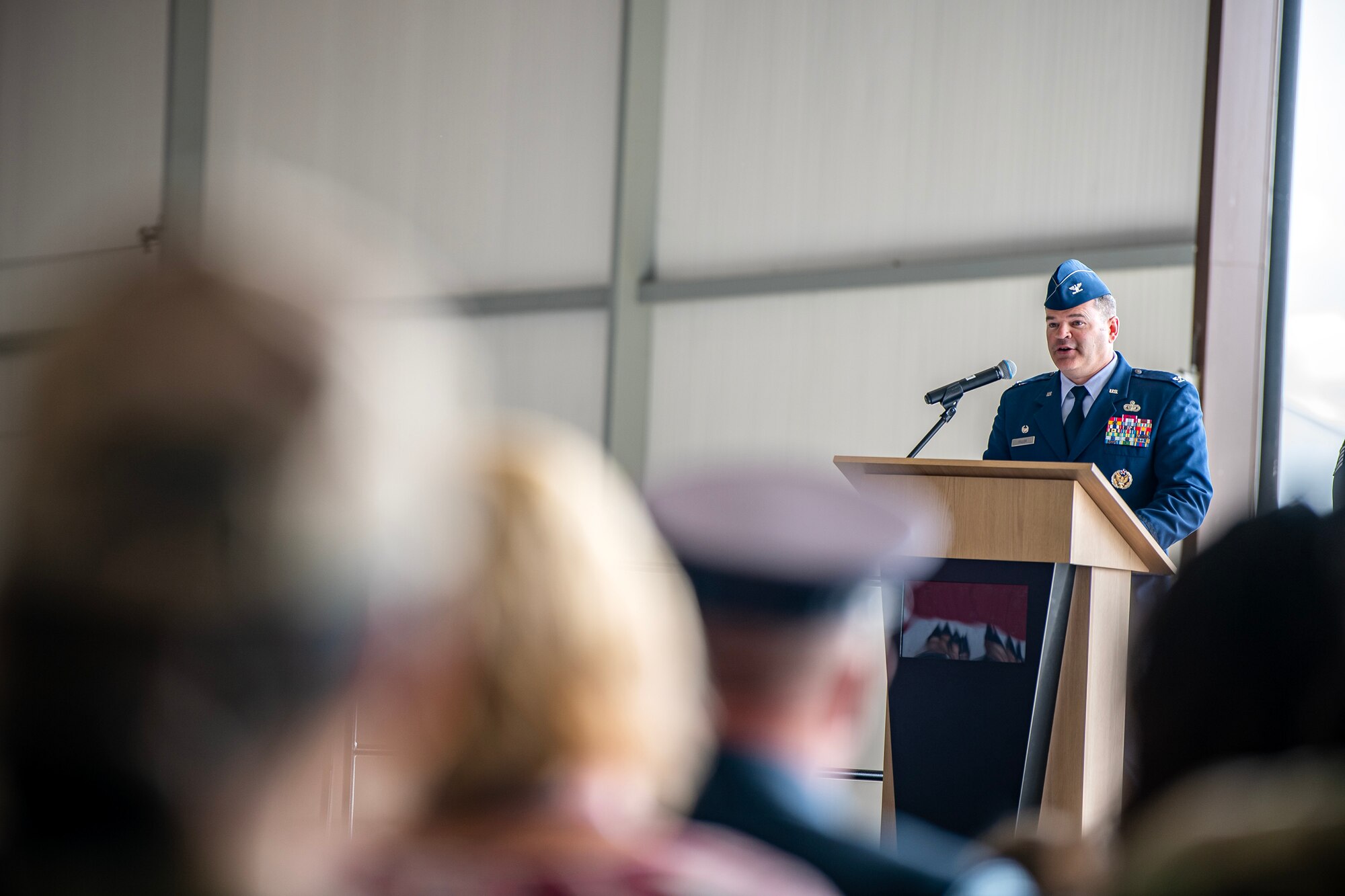 U.S. Air Force Col. Brian Filler, 501st Combat Support Wing outgoing commander, speaks during a change of command ceremony at RAF Fairford, England, July 18, 2023. During the ceremony, Filler relinquished command of the 501st CSW to Col. Dennis Phillips. (U.S. Air Force photo by Staff Sgt. Eugene Oliver)