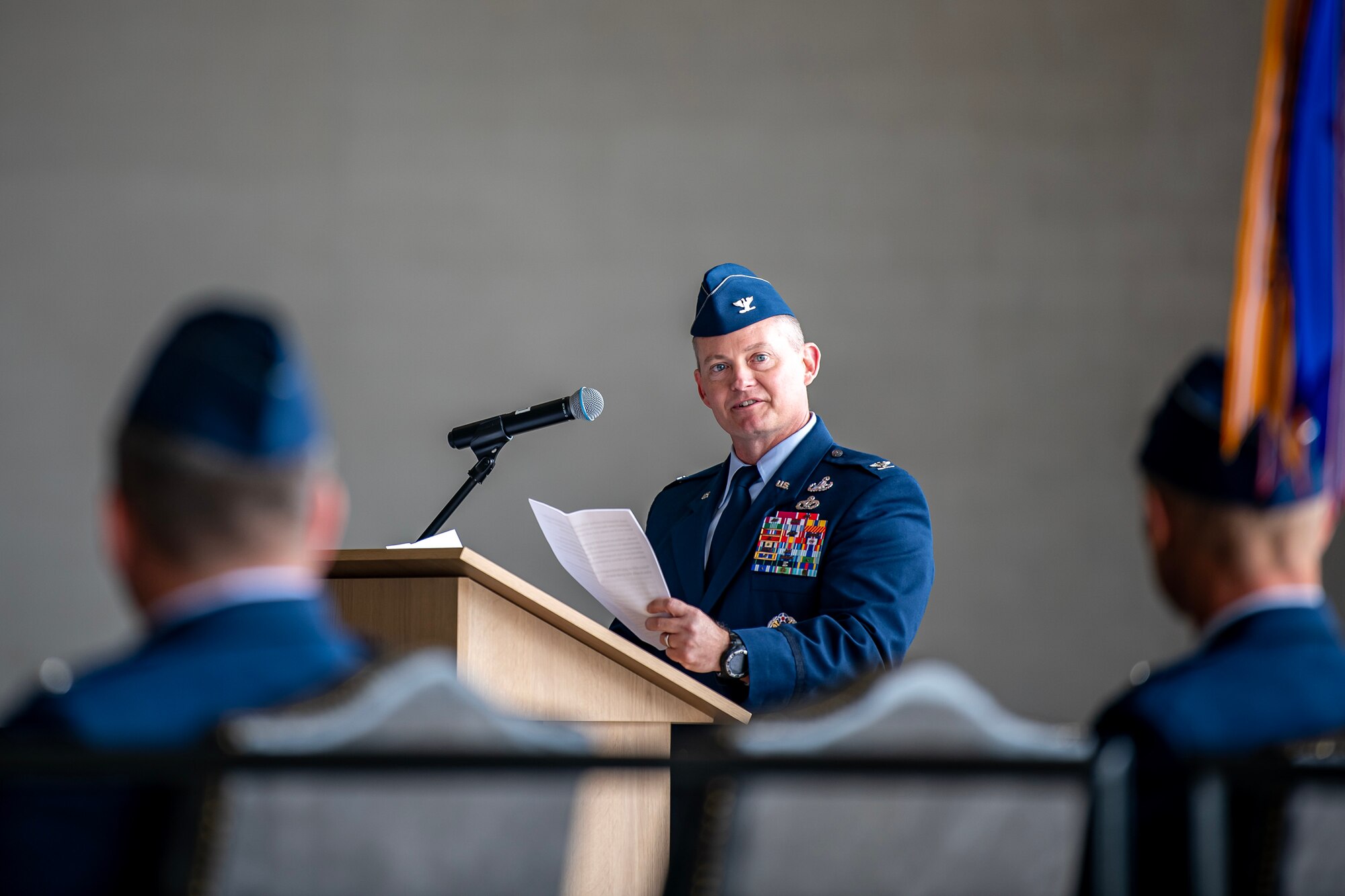 U.S. Air Force Col. Dennis Phillips, 501st Combat Support Wing commander, speaks during a change of command ceremony at RAF Fairford, England, July 18, 2023. The change of command ceremony signifies the transition of responsibility and command from one party to another. (U.S. Air Force photo by Staff Sgt. Eugene Oliver)