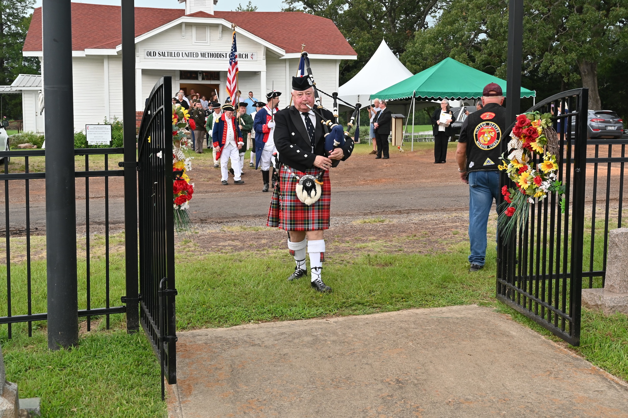 Service members, family and members of the community march to Old Saltillo Cemetery for the graveside internment service