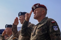 Polish Land Forces Maj. Gen. Adam Joks, V Corps outgoing deputy commanding general of interoperability, and U.S. Army Maj. Gen. Jeffery Broadwater, outgoing V Corps deputy commanding general, salute as the U.S. national anthem plays July 18, 2023, Fort Knox, Kentucky. The event was a combined welcome and farewell ceremony, referred to as Victory Honors, with special guest Polish Minister of National Defense Mariusz Błaszczak, for V Corps’ deputy commanding generals at the V Corps Headquarters. (U.S. Army photo by Spc. Devin Klecan)