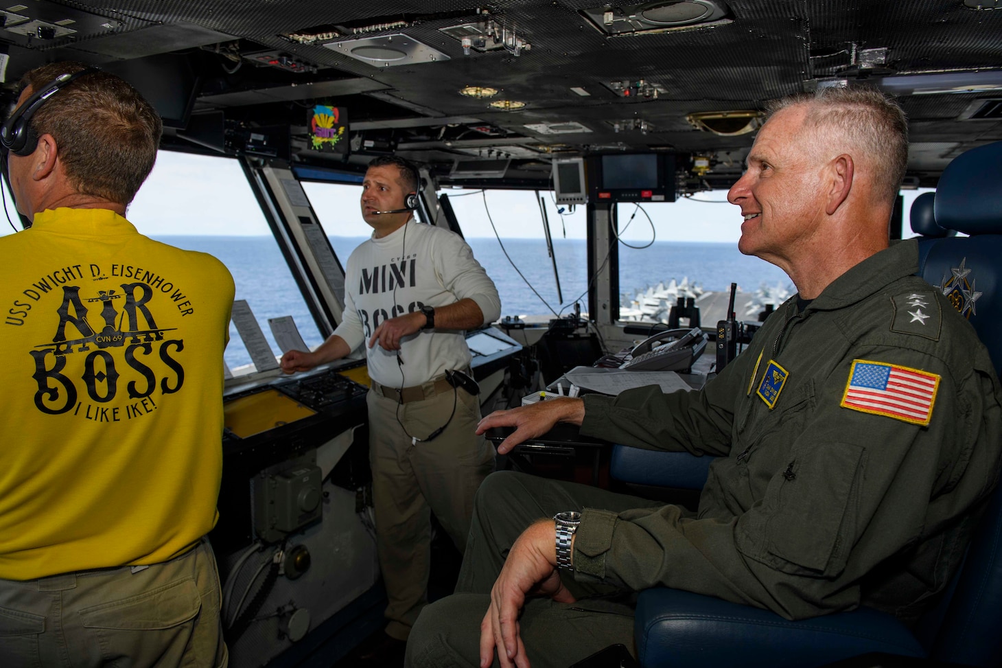 Cmdr.George Zintak, Air Boss, left, Cmdr. Andrew Babakan, Mini Boss, and, Vice Adm. Dan Dwyer, commander, U.S. Second Fleet, observe flight operations aboard the Nimitz-class aircraft carrier USS Dwight D. Eisenhower (CVN 69).