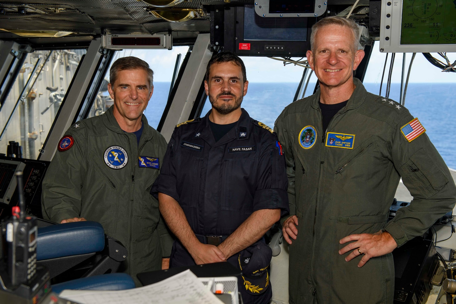 Rear Adm. Marc Miguez, commander, Carrier Strike Group Two, left, Cmdr. Fabio Casamassima, commanding officer of the Carlo Bergamini-class frigate ITS Virginio Fasan (F 591), and Vice Adm. Dan Dwyer, commander, U.S. Second Fleet, pose for a photo aboard the Nimitz-class aircraft carrier USS Dwight D. Eisenhower (CVN 69).