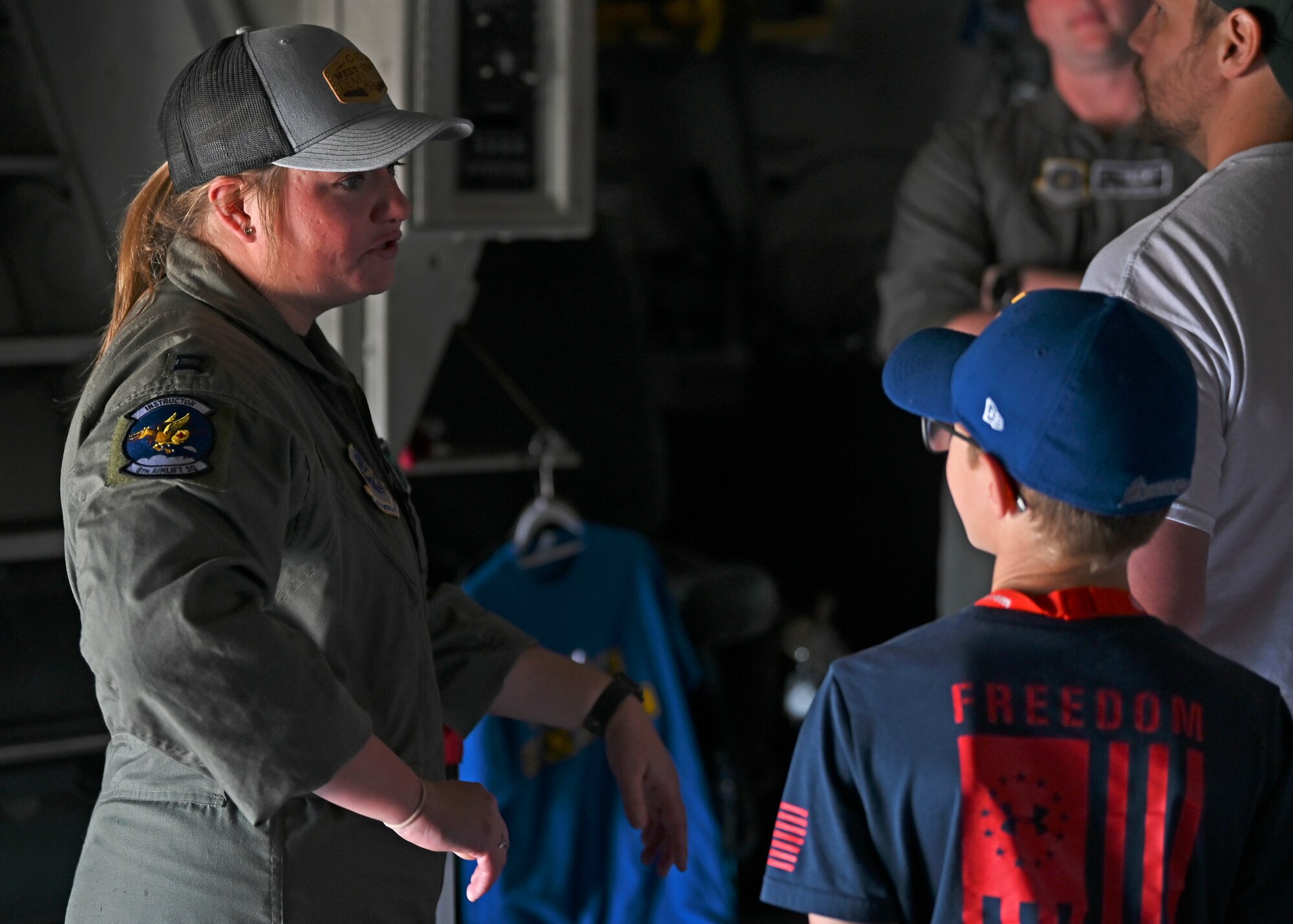 U.S. Air Force Capt. Jenny Lucas, pilot with the 8th Airlift Squadron, interacts with attendees of the Joint Base Lewis-McChord Airshow and Warrior Expo at JBLM, Washington, July 16, 2023. The mission of the JAWE is to foster goodwill to educate and familiarize attendees with the people, mission, and equipment of the Air Force, Army, and other Armed Services while continuing to provide installation-wide mission support. Another main theme of the 2023 JAWE is to celebrate 50 years of women in modern military aviation and 30 years of women in combat aviation. (U.S. Air Force photo by Senior Airman Callie Norton)
