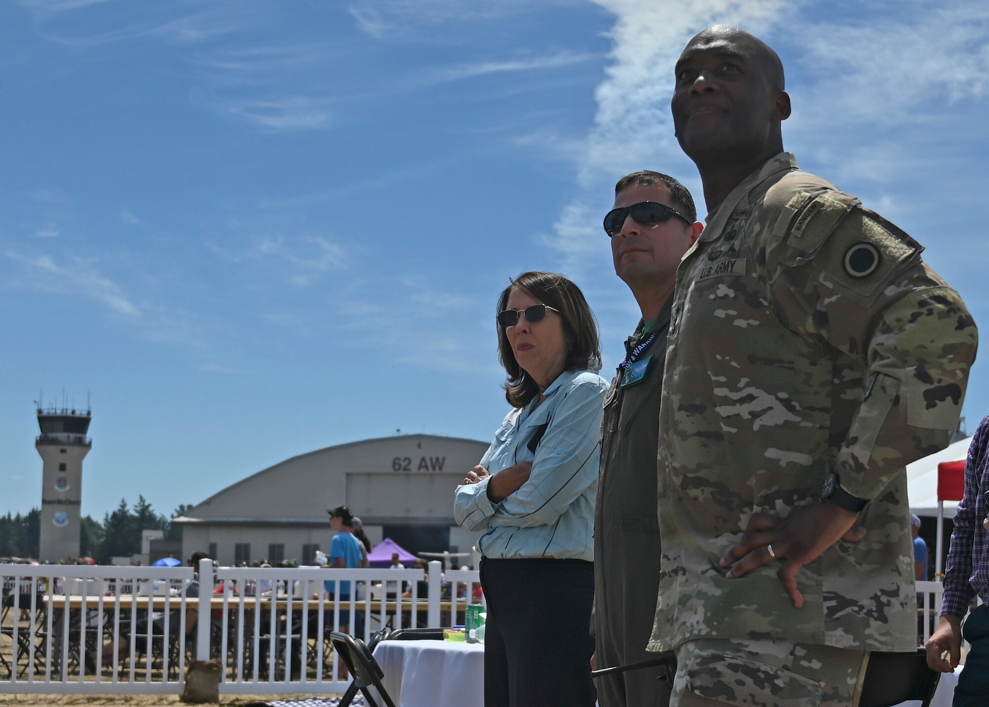 U.S. Sen. Maria Cantwell, D-Wash., left, U.S. Air Force Col. Sergio Anaya, 62d Airlift Wing commander, center, and U.S. Army Lt. Gen. Xavier Brunson, commanding general of I Corps, view an aerial demonstration from the McChord Field flightline at JBLM, Washington, July 16, 2023. The mission of the JAWE is to foster goodwill to educate and familiarize attendees with the people, mission, and equipment of the Air Force, Army, and other Armed Services while continuing to provide installation-wide mission support. (U.S. Air Force photo by Senior Airman Callie Norton)