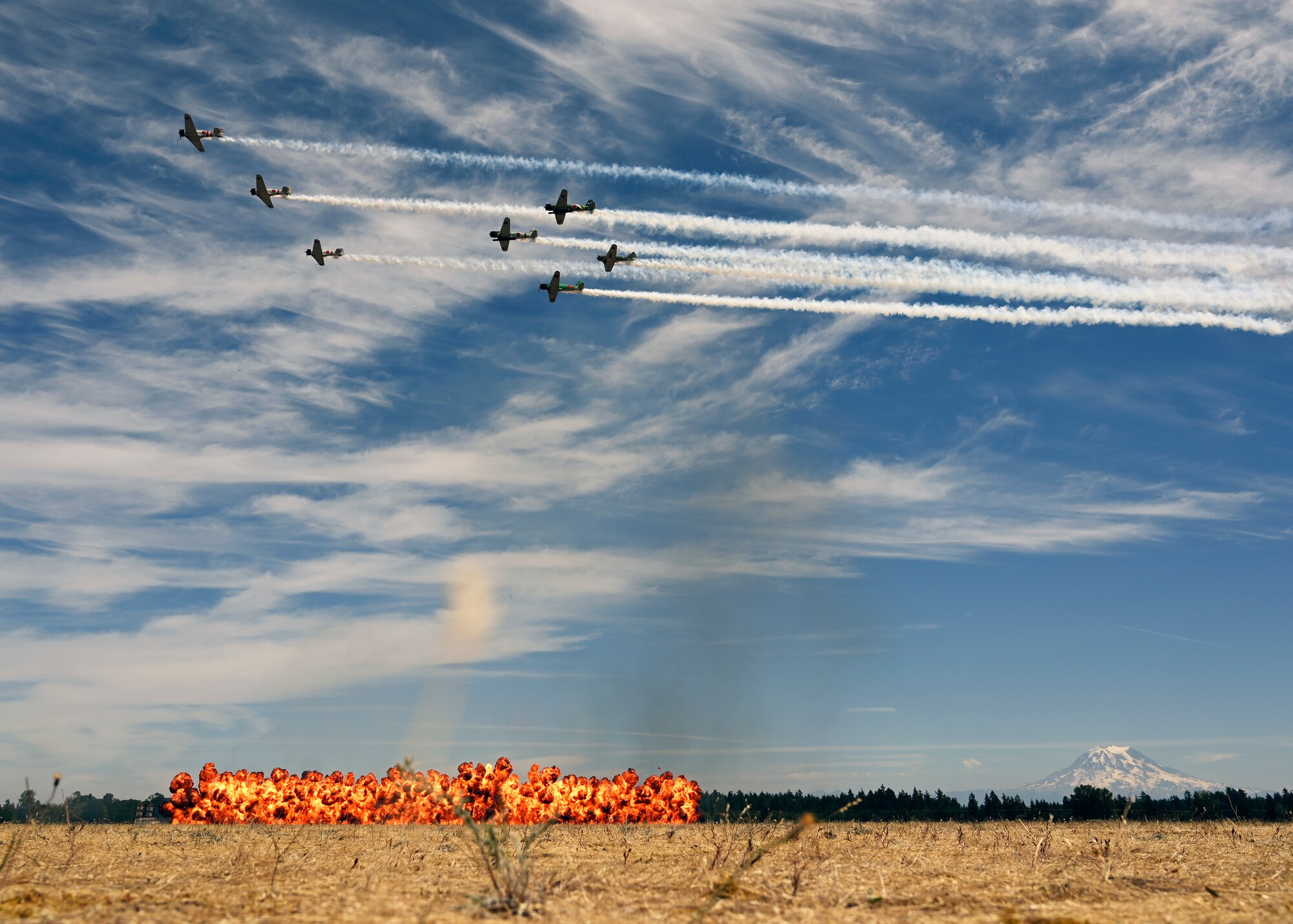 Tora! Tora! Tora! warbird performers fly above the McChord Field flightline during the Joint Base Lewis-McChord Airshow and Warrior Expo at JBLM, Washington, July 16, 2023. The mission of the JAWE is to foster goodwill to educate and familiarize attendees with the people, mission, and equipment of the Air Force, Army, and other Armed Services while continuing to provide installation-wide mission support. (U.S. Air Force photo by Senior Airman Callie Norton)