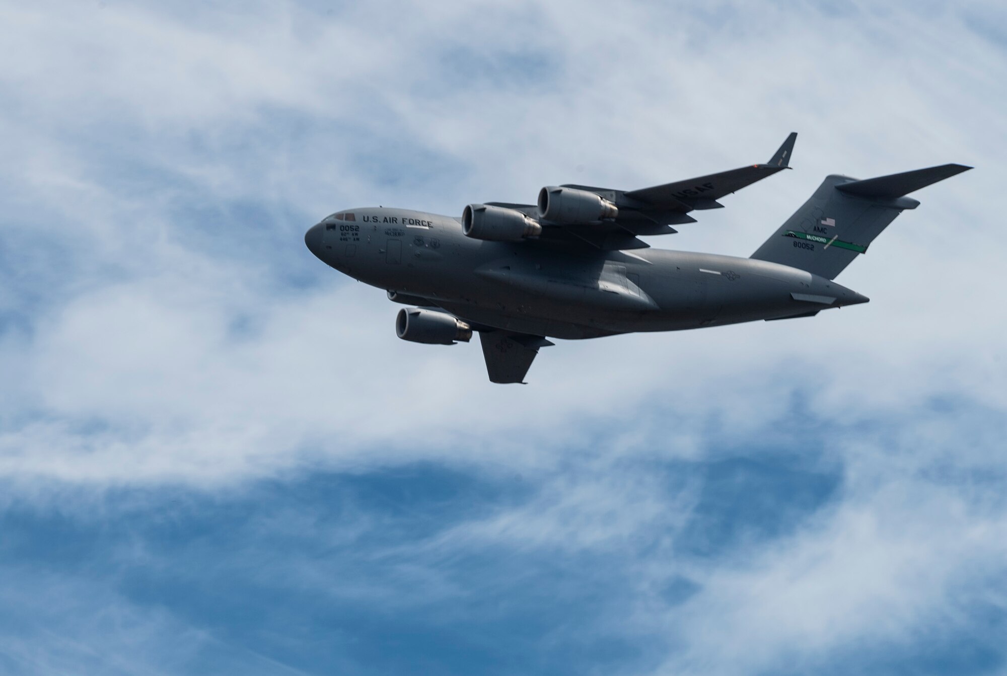 The C-17 West Coast Demonstration Team flies a C-17 Globemaster III above the McChord Field flightline during the Joint Base Lewis-McChord Airshow and Warrior Expo at JBLM, Washington, July 16, 2023. The mission of the JAWE is to foster goodwill to educate and familiarize attendees with the people, mission, and equipment of the Air Force, Army, and other Armed Services while continuing to provide installation-wide mission support. (U.S. Air Force photo by Staff Sgt. Rachel Williams)