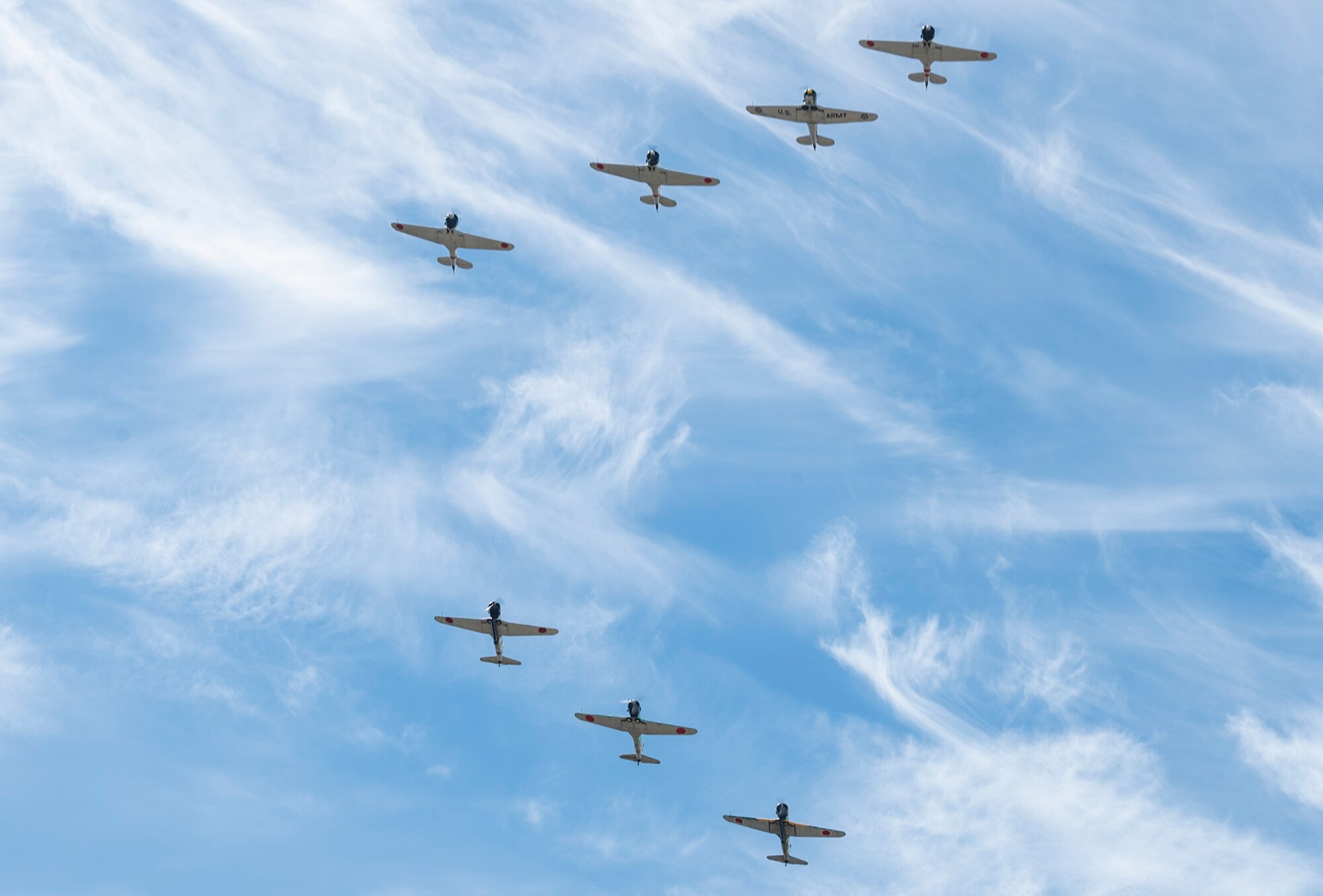 Tora! Tora! Tora! warbird performers flies above the McChord Field flightline during the Joint Base Lewis-McChord Airshow and Warrior Expo at JBLM, Washington, July 16, 2023. The mission of the JAWE is to foster goodwill to educate and familiarize attendees with the people, mission, and equipment of the Air Force, Army, and other Armed Services while continuing to provide installation-wide mission support. (U.S. Air Force photo by Staff Sgt. Rachel Williams)
