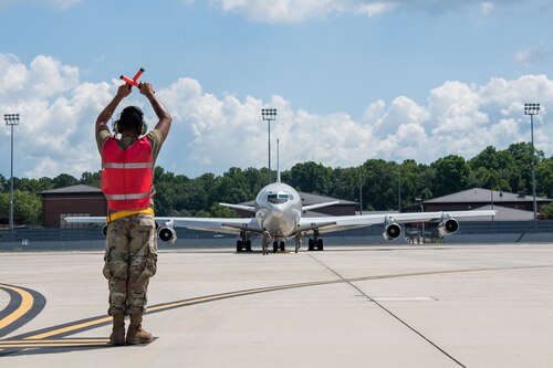 Man marshalling an airplane