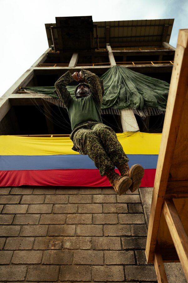 A Colombian reconnaissance Marine demonstrates proper jumping form during low level static line training for UNITAS LXIV at Cartagena, Colombia, July 17, 2023. During UNITAS, reconnaissance and special operation force Marines from partner and allied nations conducted multilateral special operations training consisting of room clearing, visit board search and seizure, jungle patrolling, low level static line jumping, small arms, and helicopter rope suspension tactics. UNITAS, hosted by Colombia this year, is the world’s longest-running annual multinational maritime exercise that focuses on enhancing interoperability among multiple nations and joint forces during littoral and amphibious operations in order to build on existing regional partnerships and create new enduring relationships that promote peace, stability, and prosperity in the U.S. Southern Command’s area of responsibility. (U.S. Marine Corps photo by Sgt. Colton K. Garrett)