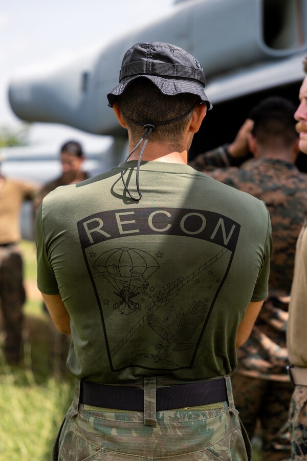 A Brazilian Marine stands near a U.S. Marine Corps UH-1Y Venom during low level static line training for UNITAS LXIV at Cartagena, Colombia, July 17, 2023. During UNITAS, reconnaissance and special operation force Marines from partner and allied nations conducted multilateral special operations training consisting of room clearing, visit board search and seizure, jungle patrolling, low level static line jumping, small arms, and helicopter rope suspension tactics. UNITAS, hosted by Colombia this year, is the world’s longest-running annual multinational maritime exercise that focuses on enhancing interoperability among multiple nations and joint forces during littoral and amphibious operations in order to build on existing regional partnerships and create new enduring relationships that promote peace, stability, and prosperity in the U.S. Southern Command’s area of responsibility. (U.S. Marine Corps photo by Sgt. Colton K. Garrett)