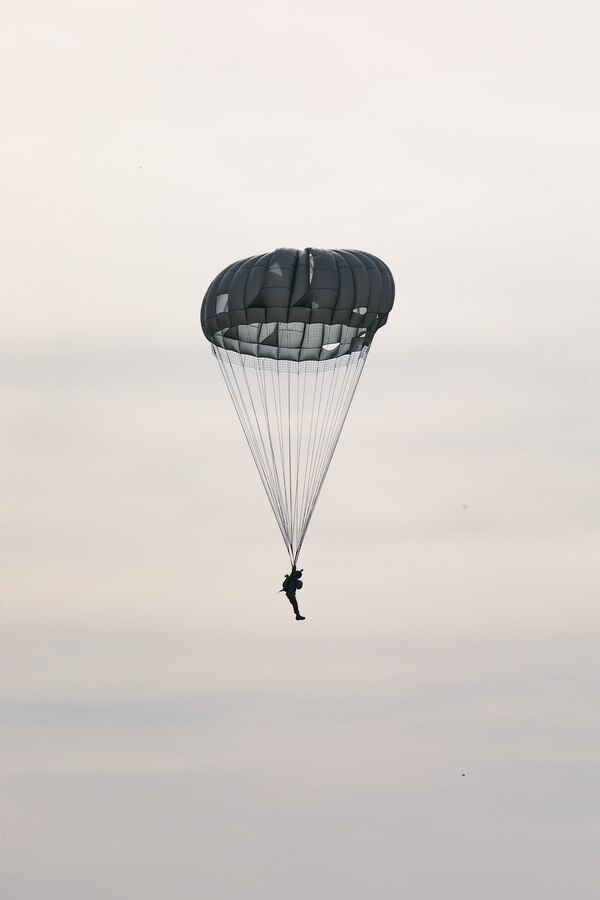 A Colombian reconnaissance Marine parachutes during low level static line training for UNITAS LXIV at Cartagena, Colombia, July 18, 2023. During UNITAS, reconnaissance and special operation force Marines from partner and allied nations conducted multilateral special operations training consisting of room clearing, visit board search and seizure, jungle patrolling, low level static line jumping, small arms, and helicopter rope suspension tactics. UNITAS, hosted by Colombia this year, is the world’s longest-running annual multinational maritime exercise that focuses on enhancing interoperability among multiple nations and joint forces during littoral and amphibious operations in order to build on existing regional partnerships and create new enduring relationships that promote peace, stability, and prosperity in the U.S. Southern Command’s area of responsibility. (U.S. Marine Corps photo by Sgt. Colton K. Garrett)
