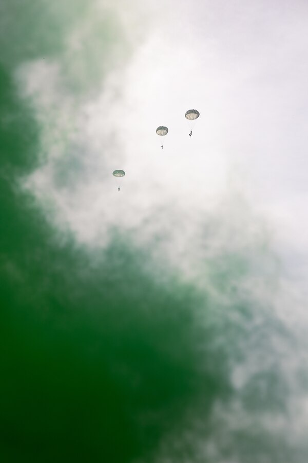Reconnaissance Marines from partner and allied nations parachute during low level static line training for UNITAS LXIV at Cartagena, Colombia, July 18, 2023. During UNITAS, reconnaissance and special operation force Marines from partner and allied nations conducted multilateral special operations training consisting of room clearing, visit board search and seizure, jungle patrolling, low level static line jumping, small arms, and helicopter rope suspension tactics. UNITAS, hosted by Colombia this year, is the world’s longest-running annual multinational maritime exercise that focuses on enhancing interoperability among multiple nations and joint forces during littoral and amphibious operations in order to build on existing regional partnerships and create new enduring relationships that promote peace, stability, and prosperity in the U.S. Southern Command’s area of responsibility. (U.S. Marine Corps photo by Sgt. Colton K. Garrett)