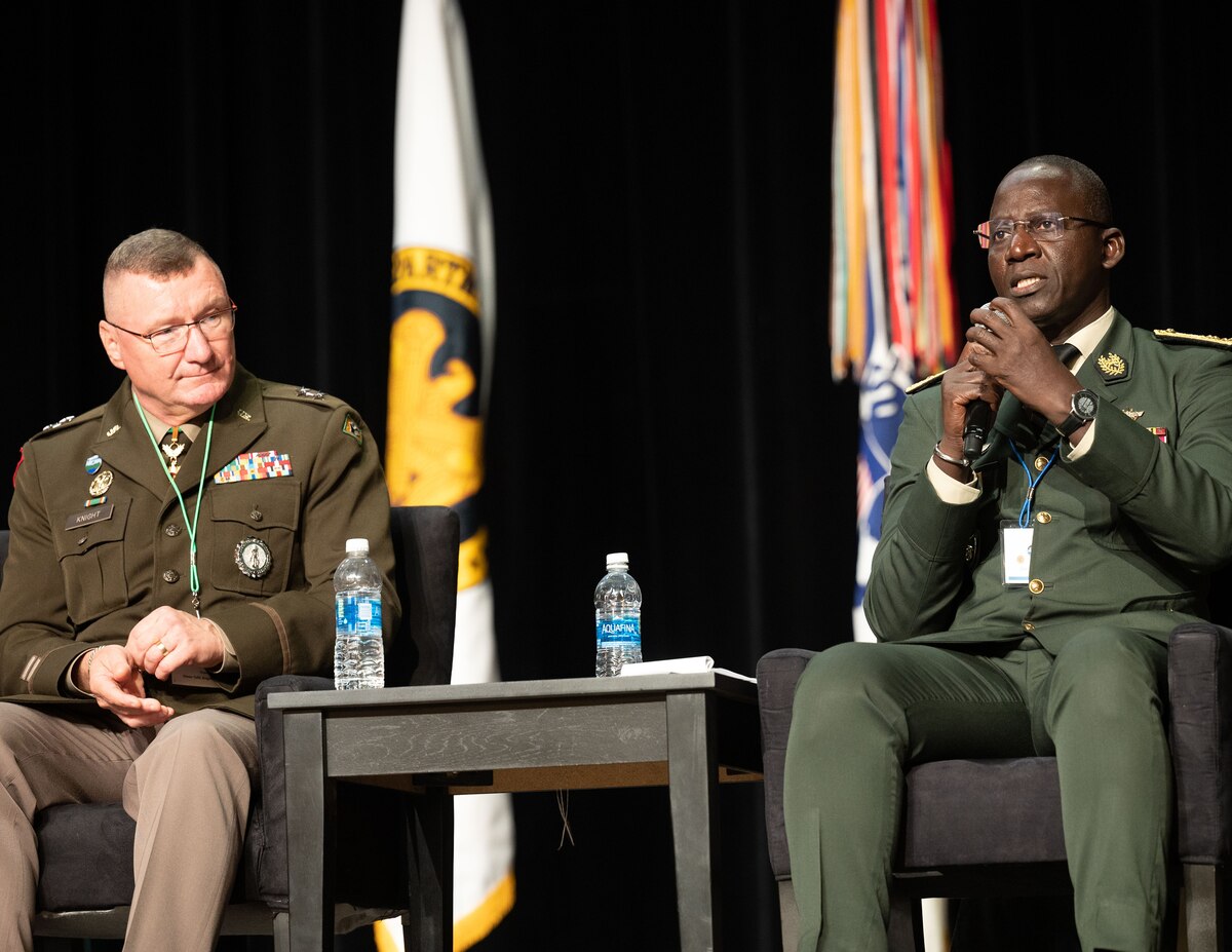 Senegalese General Mbaye Cissé, chief of general staff, Senegalese Armed Forces, right, delivers remarks as U.S. Army Maj. Gen. Gregory Knight, adjutant general, Vermont National Guard listens intently during a panel discussion with U.S. National Guard, U.S. government officials, and senior principals from partner nations on the topic of expanding partnerships beyond military relations during the Department of Defense and National Guard State Partnership Program (SPP) 30th Anniversary Conference, National Harbor, Maryland, July 19, 2023. The SPP program pairs Guard elements with partner nations worldwide, building enduring relationships through mutual training exchanges that strengthen security, improve operability and enhance the readiness of U.S. and partner forces. Established in 1993, the program began with less than a dozen partnerships and has grown to include 100 countries representing more than 50% of the world’s nations. (U.S. Air National Guard photo by Master Sgt. David Eichaker)