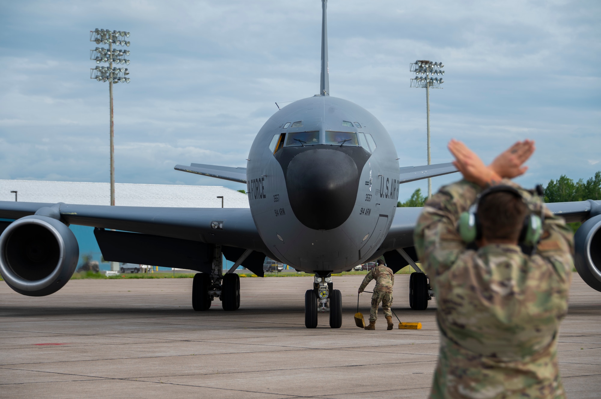 U.S. Airmen, assigned to the 707th Maintenance Squadron, marshal a 914th Air Refueling Wing KC-135 Stratotanker as it lands at Griffiss Air Force Base, New York, June 23, 2023.