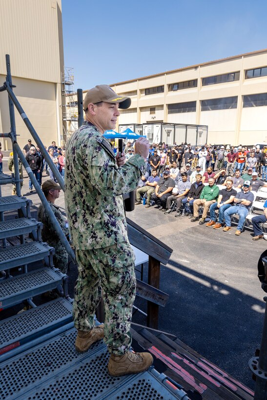 Capt. JD Crinklaw, commander, Puget Sound Naval Shipyard & Intermediate Maintenance Facility, congratulates USS Abraham Lincoln (CVN 72) project team members in San Diego, June 27, 2023, during his first visit there as PSNS & IMF commander. Crinklaw also gave out awards and helped serve food during the barbecue. (U.S. Navy photo by Wendy Hallmark)