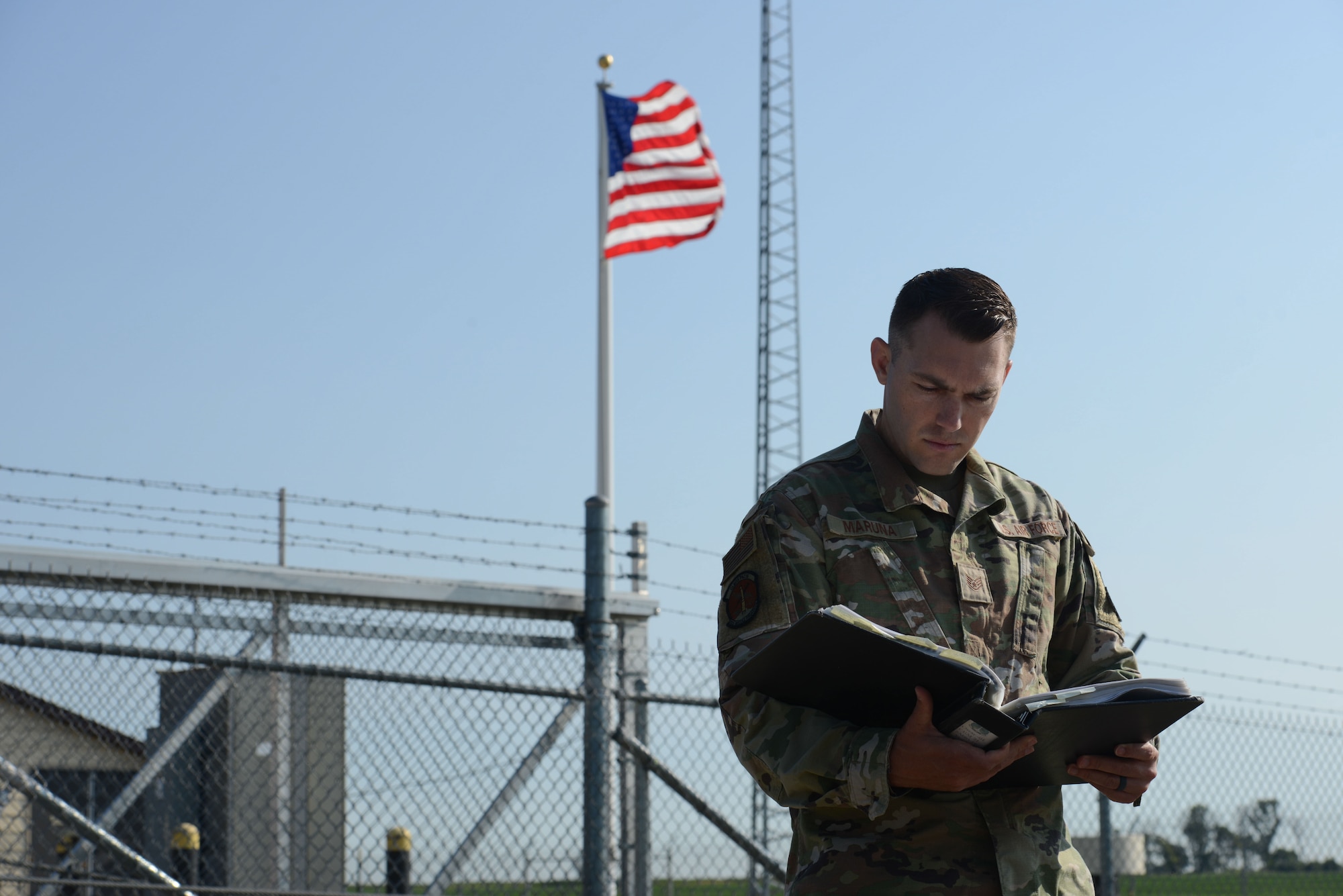 U.S. Air Force Staff Sgt. Edward Maruna, 742nd Missile Squadron facility manager, reviews documents pertinent to his duties at Minot Air Force Base, North Dakota, July 7, 2023. Maruna’s job is to perform equipment checks and maintain efficiency on the missile site. (U.S. Air Force photo by Airman 1st Class Trust Tate)