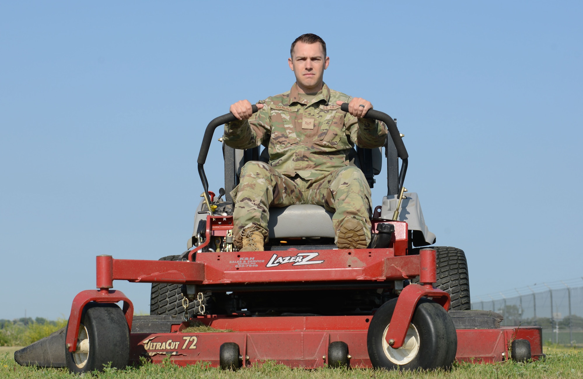 U.S. Air Force Staff Sgt. Edward Maruna, 742nd Missile Squadron facility manager, finishes up his daily duty of mowing the grass around a missile site at Minot Air Force Base, North Dakota, July 7, 2023. Maruna makes sure the grass is cut to prevent any obstructions, like wildlife, from getting in the alert response team’s way of safeguarding the site. (U.S. Air Force photo by Airman 1st Class Trust Tate)
