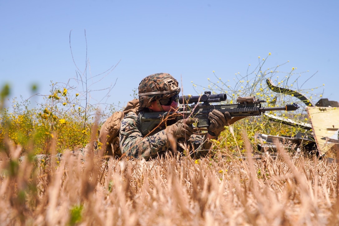 U.S. Marine Corps Lance Cpl. Morse, a machine gunner assigned to Weapons Company, Battalion Landing Team 1/5, 15th Marine Expeditionary Unit, establishes security during tactical recovery of aircraft and personnel training at Marine Corps Base Camp Pendleton, California, June 26, 2023. The training, part of the I Marine Expeditionary Force Expeditionary Operations Training Group TRAP course, develops the capabilities of the TRAP force to enhance their capabilities recover aircraft, personnel, and equipment in austere environments. (U.S. Marine Corps photo by Lance Cpl. Kahle)
