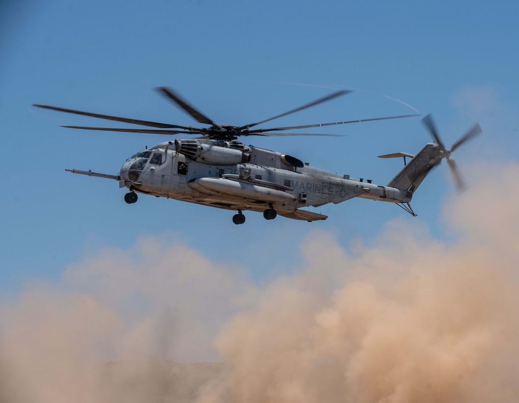 A U.S. Marine Corps CH-53E Super Stallion assigned to Marine Medium Tiltrotor Squadron (VMM) 165 (Reinforced), 15th Marine Expeditionary Unit, prepares land during tactical recovery of aircraft and personnel training at Marine Corps Base Camp Pendleton, California, June 30, 2023. The training, part of the I Marine Expeditionary Force Expeditionary Operations Training Group TRAP course, develops the capabilities of the TRAP force to enhance their capabilities recover aircraft, personnel, and equipment in austere environments. (U.S. Marine Corps photo by Lance Cpl.  Kahle)