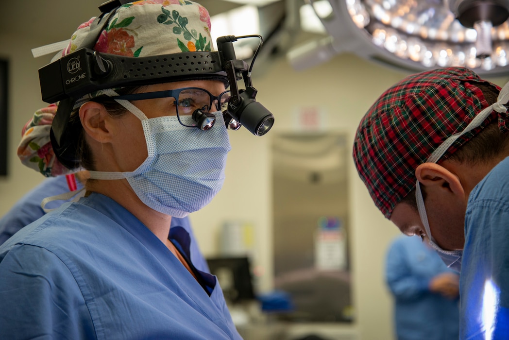 Maj. Amy Moore prepares to perform surgery on a patient