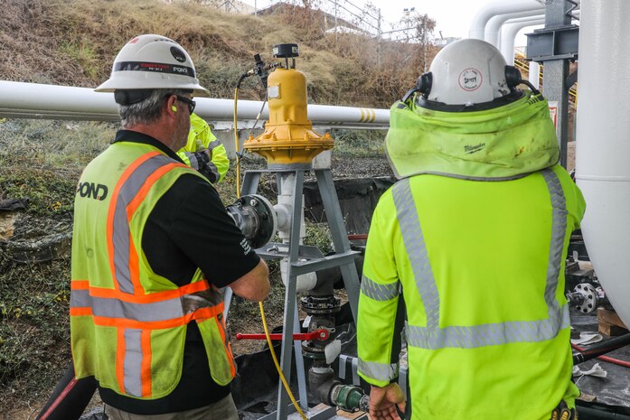 Civilians assigned to Joint Task Force-Red Hill (JTF-RH) monitor a fuel pump during surge tank draining at the Red Hill Bulk Fuel Storage Facility (RHBFSF) on Joint Base Pearl Harbor-Hickam Honolulu, Hawaii, July 19, 2023. JTF-RH is in phase three of its five-phase defueling plan. Personnel are focused on completing quality control tasks, training, response preparation, the National Environmental Policy Act Environmental Assessment, regulatory approvals and operational planning for all future major milestones. This extensive preparatory work will help ensure the safe and expeditious defueling of the RHBFSF. (DoD photo by U.S. Army Sgt. Kyler L. Chatman)
