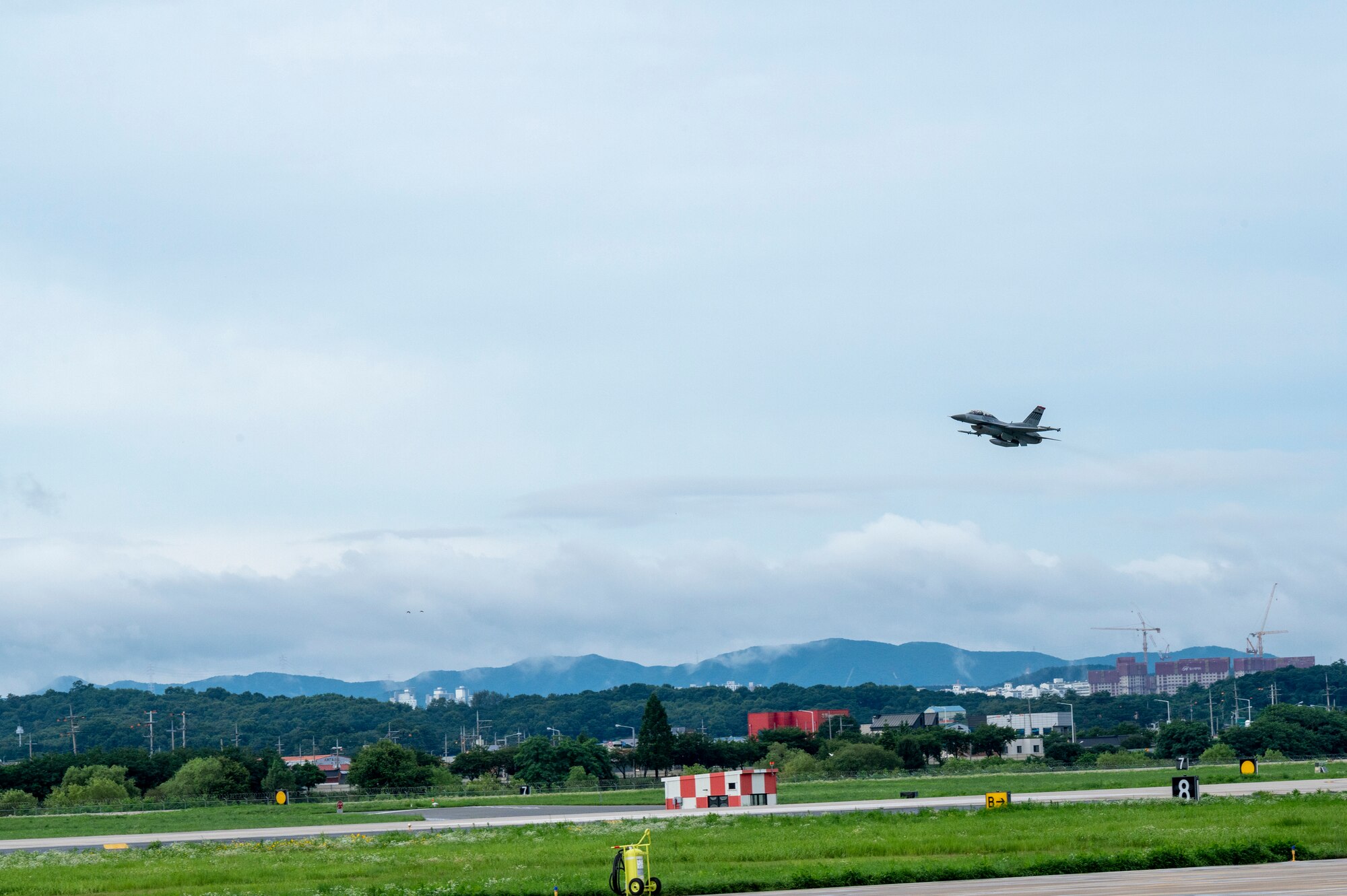 U.S. Air Force Col. William McKibban, 51st Fighter Wing commander, and U.S. Army Command Sgt. Maj. Jack Love, U.S. Forces Korea Senior Enlisted Advisor, take off in an F-16D Fighting Falcon at Osan Air Base, Republic of Korea, July 18, 2023. The D-model is a two-seat variant of the F-16 fighter jet which allows for familiarization flights. (U.S. Air Force photo by Senior Airman Aaron Edwards)
