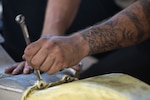 A U.S. Airman assigned to the 5th Maintenance Group performs routine maintenance on a U.S. Air Force B-52H Stratofortress assigned to the 23rd Expeditionary Bomb Squadron during a Bomber Task Force deployment at Andersen Air Force Base, Guam, July 9, 2023. BTF deployments like this enhance the readiness and training necessary to respond to any potential crisis or challenge across the globe. (U.S. Air Force photo by Tech. Sgt. Zade Vadnais)