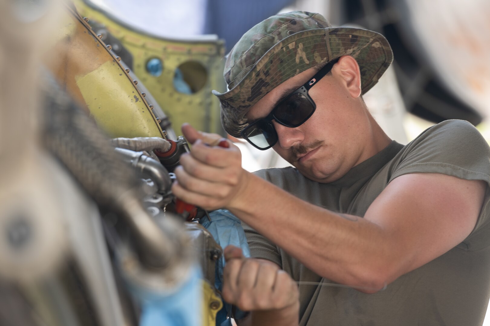 U.S. Air Force Senior Airman Matthew Thibodeau, 5th Aircraft Maintenance Squadron aerospace propulsion technician, replaces an unserviceable constant speed direct oil cooler on a U.S. Air Force B-52H Stratofortress during routine engine maintenance in support of a Bomber Task Force deployment at Andersen Air Force Base, Guam, July 9, 2023. BTF deployments like this enhance the readiness and training necessary to respond to any potential crisis or challenge across the globe. (U.S. Air Force photo by Tech. Sgt. Zade Vadnais)