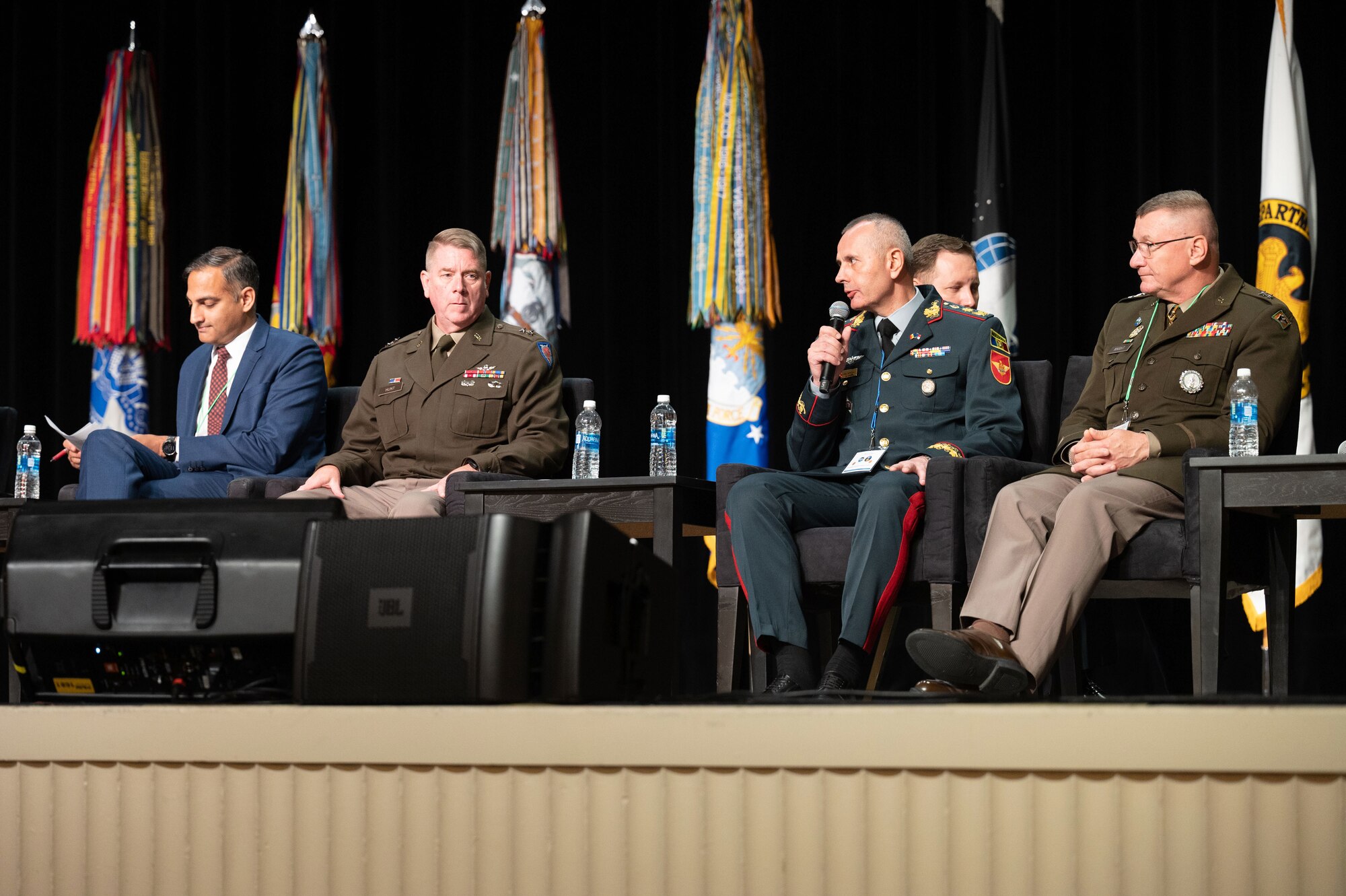 Moldovan Brig. Gen. Eduard Ohladciuc, chief of general staff, Moldovan Armed Forces, right center, delivers remarks while participating in a panel discussion with U.S. National Guard, U.S. government officials, and senior principals from partner nations on the topic of expanding partnerships beyond military relations during the Department of Defense and National Guard State Partnership Program (SPP) 30th Anniversary Conference, National Harbor, Maryland, July 19, 2023. The SPP program pairs Guard elements with partner nations worldwide, building enduring relationships through mutual training exchanges that strengthen security, improve operability and enhance the readiness of U.S. and partner forces. Established in 1993, the program began with less than a dozen partnerships and has grown to include 100 countries representing more than 50% of the world’s nations. (U.S. Air National Guard photo by Master Sgt. David Eichaker)