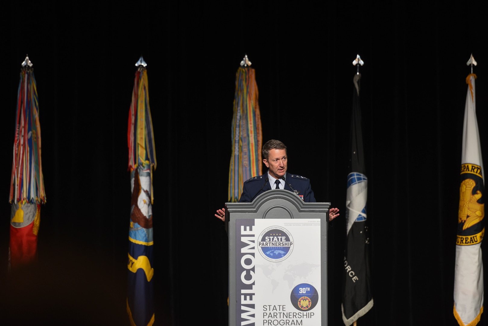 Air Force Lt. Gen. Dan Caine, associate director for military affairs with the Central Intelligence Agency speaks about global threats and challenges during the Department of Defense and National Guard State Partnership Program 30th Anniversary Conference at National Harbor, Maryland, July 17, 2023.