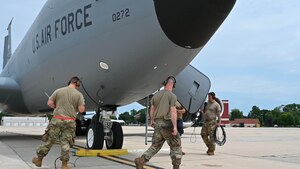 Airmen from the 127th Logistics Readiness Squadron and 434th Aircraft Maintenance Squadron pack up equipment and do final checks after a hot refueling of a KC-135R Stratotanker, July 12, 2023, at Selfridge Air National Guard Base, Michigan. Hot refueling allows an aircraft’s engines to remain running while being refueled, increasing the capabilities of aircraft to land anywhere, refuel and take-off much faster. (U.S. Air Force Photo by Amn Elise Faurote)