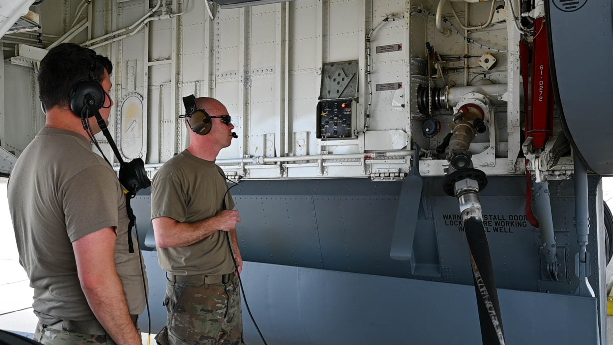 Airmen standby as a KC-135R Stratotanker is refueled, July 12, 2023, at Selfridge Air National Guard Base, Michigan. Hot refueling allows an aircraft’s engines to remain running while being refueled, increasing the capabilities of aircraft to land anywhere, refuel and take-off much faster. (U.S. Air Force Photo by Amn Elise Faurote)