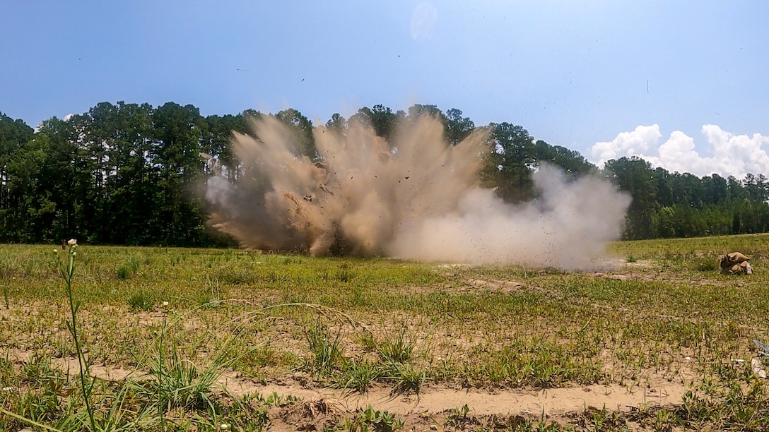 Ordnance is detonated utilizing sandbags to absorb shrapnel and other hazards at Marine Corps Air Station Cherry Point, North Carolina, June 29, 2023. Explosive Ordnance Disposal conducted a training event to maintain their proficiency on protective works, a technique utilized to detonate unexploded ordnance while mitigating collateral damage. (U.S. Marine Corps photo by Cpl. Noah Braswell)