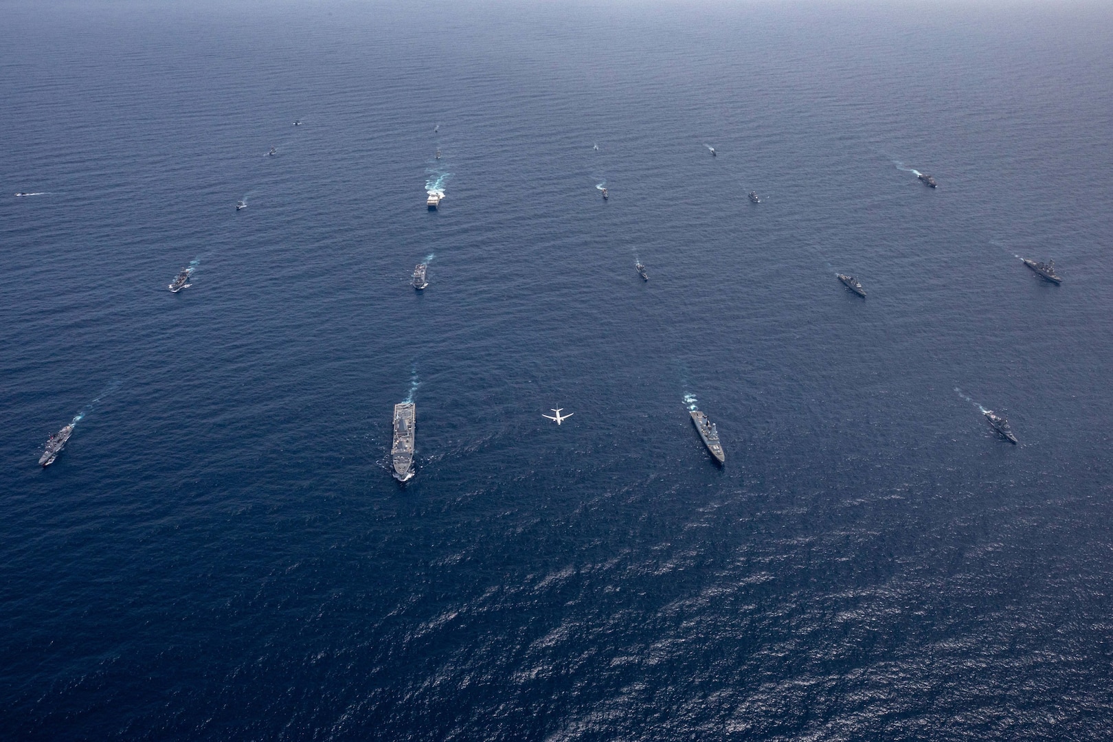 Ships and Aircraft participating in UNITAS 23 steam into formation in the Caribbean Sea, July 16, 2023.