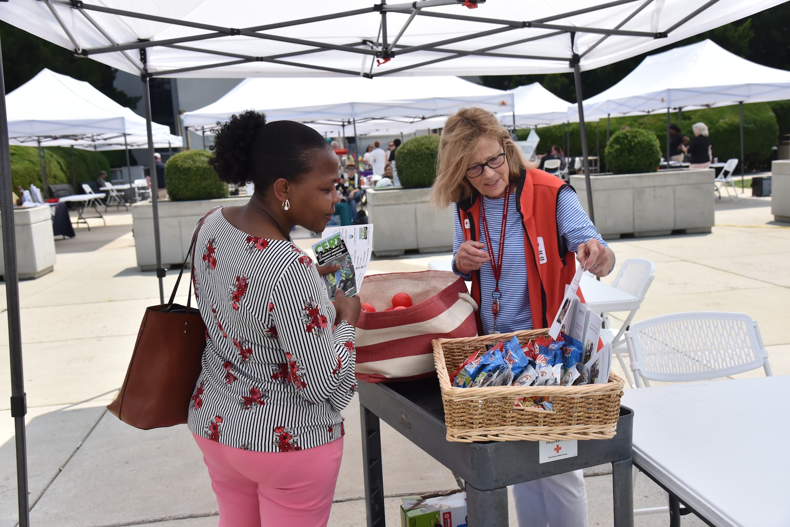 American Red Cross volunteer shares information during Safety Day Celebration 2023.