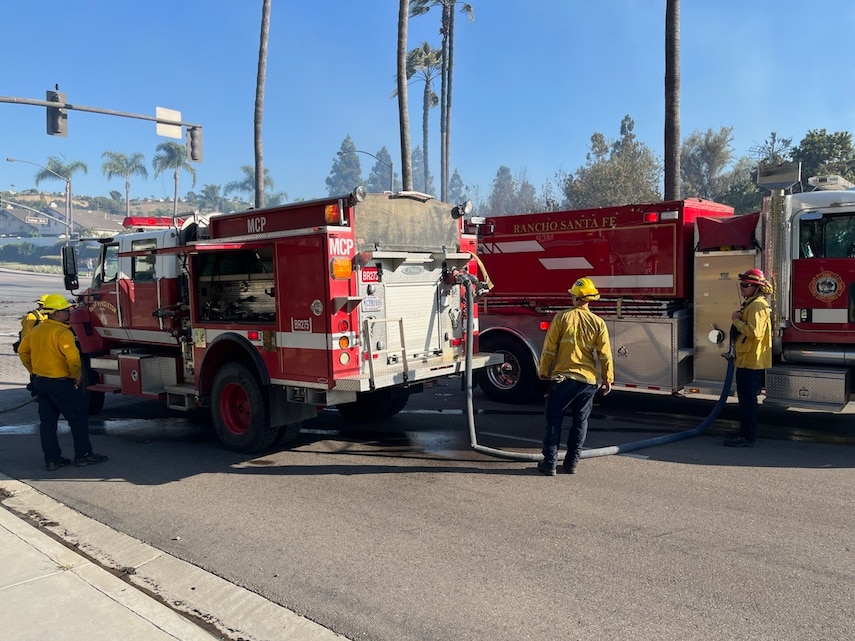 Firefighters with Camp Pendleton Fire Department and Rancho Santa Fe Fire Department work to put out a fire in Oceanside California, July 9, 2023. Camp Pendleton Fire Department worked alongside the Oceanside Fire Department and other local first responders to extinguish the fire and keep neighboring communities safe.