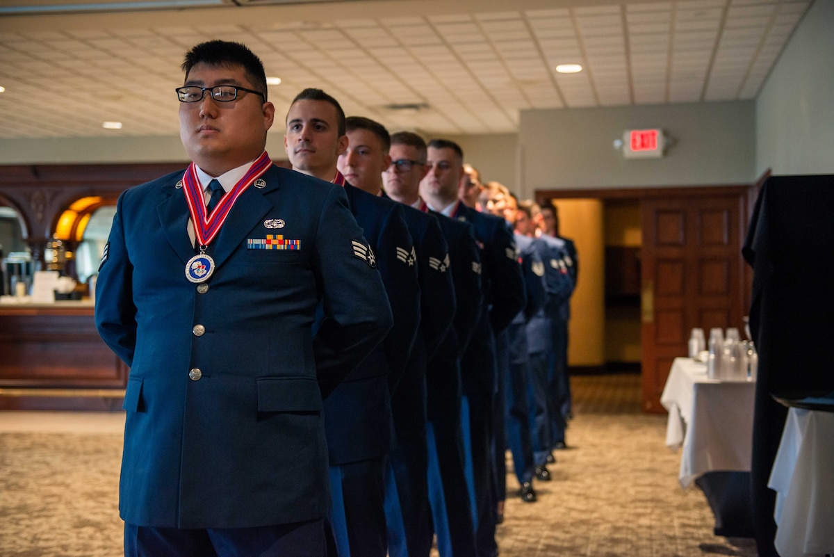 Airman wait for their name to be called to fall out of formation.