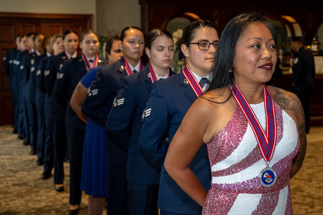 Airman wait for their names to be called out of formation.