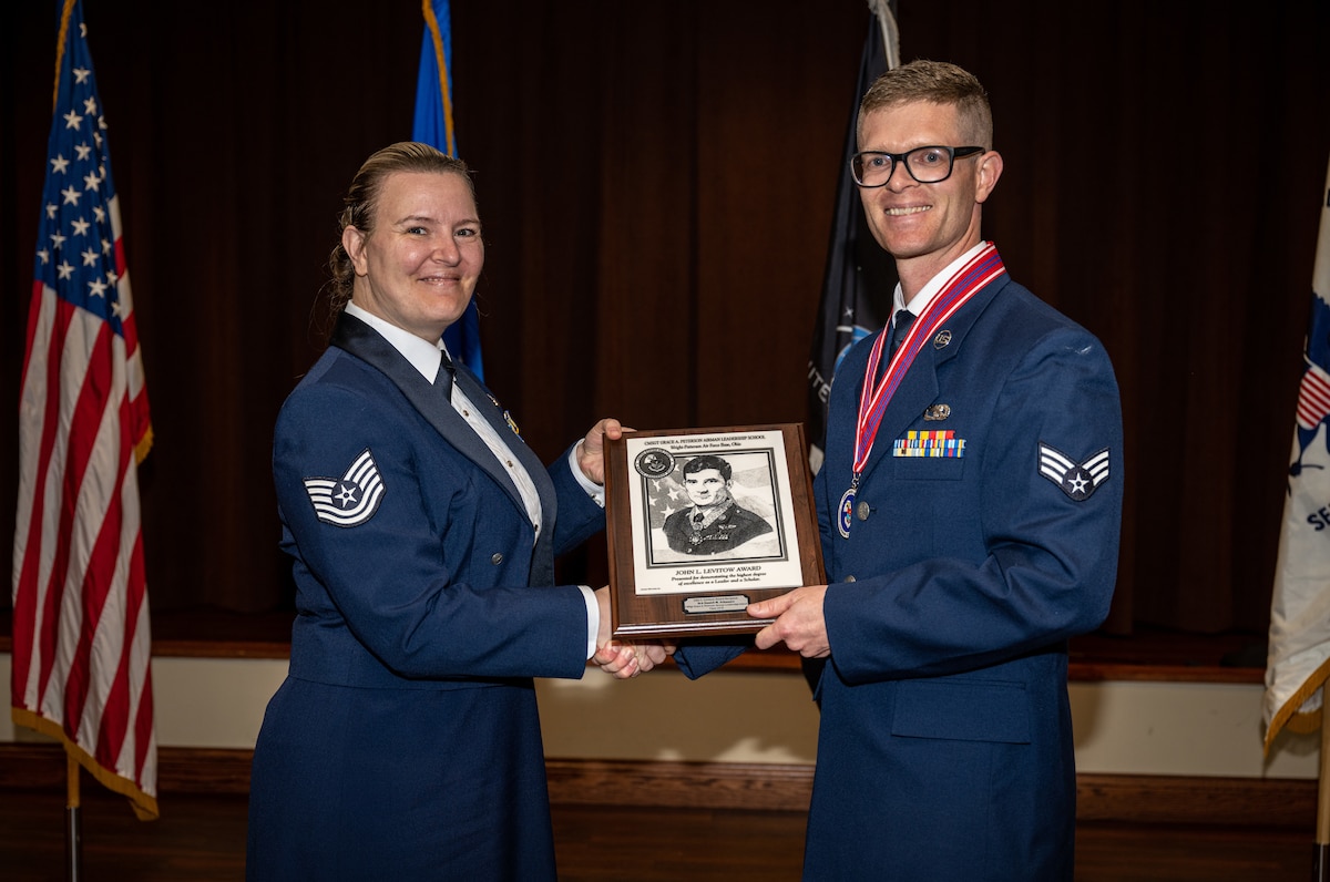 Airman receives academic excellence award.