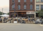 Piles of debris stacked up outside the Savoy Theatre after historic flooding in Montpelier, VT, July 18, 2023.