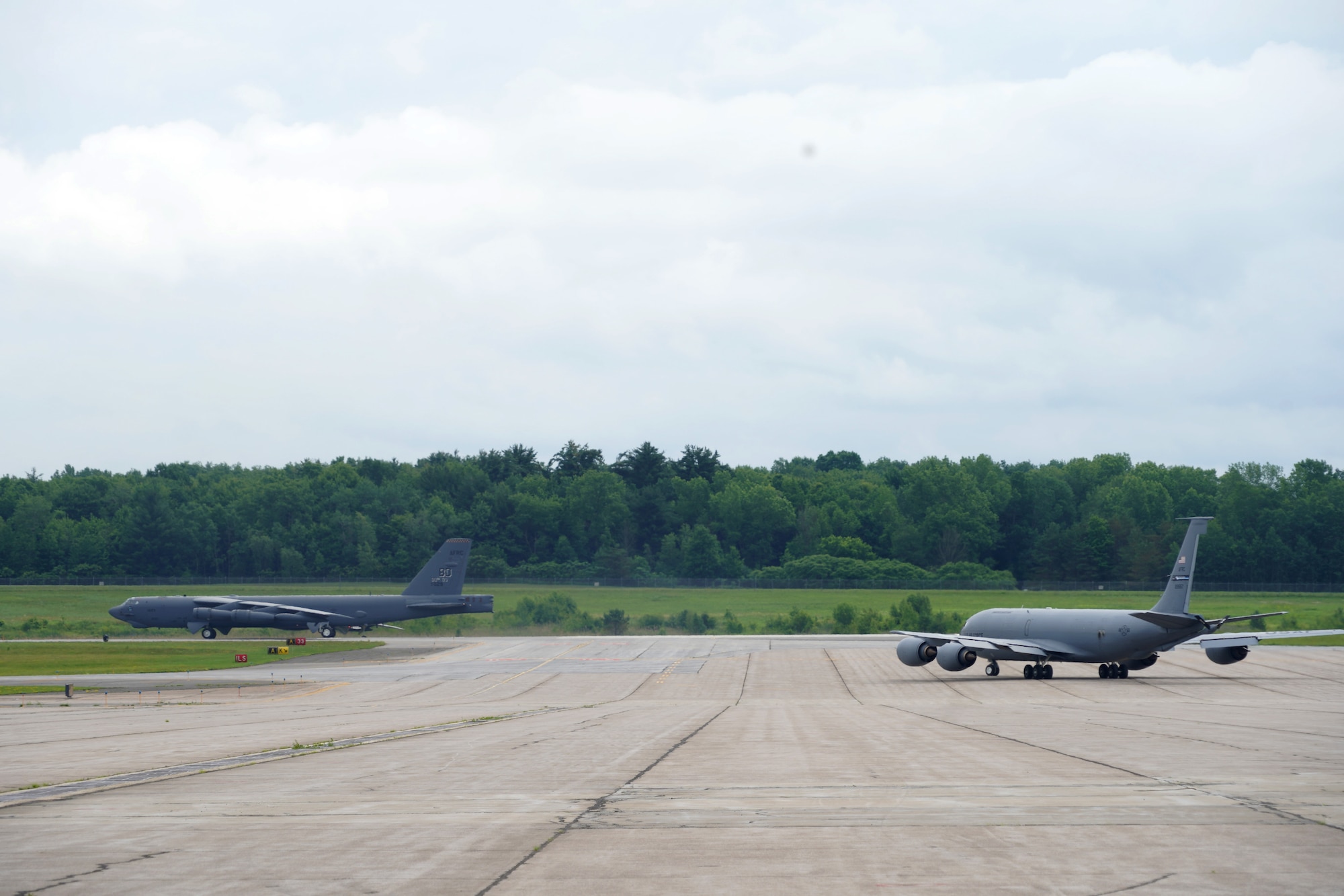 A B-52 Stratofortress assigned to the 307th Bomb Wing and KC-135 Stratotanker assigned to the 914th Air Refueling Wing, taxi for departure at Griffiss International Airport, Rome, New York, site of the former Strategic Air Command base.