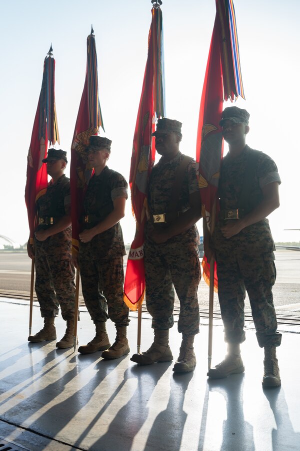 U.S. Marines with 4th Marine Aircraft Wing stand the color guard positions to commence a change of command ceremony on Naval Air Station Joint Reserve Base, New Orleans, Louisiana, July 15, 2023. The ceremony signified the official transfer of command of 4th MAW from Maj. Gen. Leonard Anderson IV to Maj. Gen. John Kelliher III. (U.S. Marine Corps photo by Cpl. Ujian Gosun)
