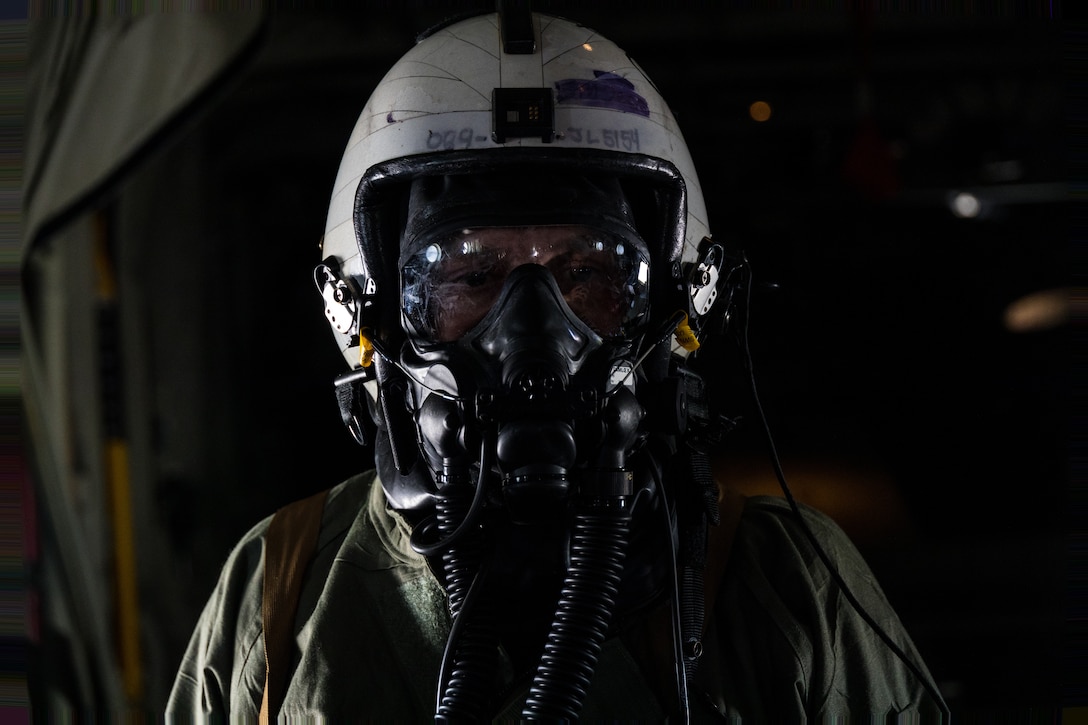U.S. Marine Corps Staff Sgt. John Luke, a KC-130J Super Hercules loadmaster with Marine Aerial Refueler Transport Squadron (VMGR) 252, poses for a picture while donning mission-oriented protective posture (MOPP) gear at Marine Corps Air Station Cherry Point, North Carolina, July 12, 2023. Pilots and aircrew trained in MOPP gear to maintain their readiness in preparation for an upcoming deployment. VMGR-252 is a subordinate unit of 2nd Marine Aircraft Wing, the aviation combat element of II Marine Expeditionary Force. (U.S. Marine Corps photo by Cpl. Rowdy Vanskike)
