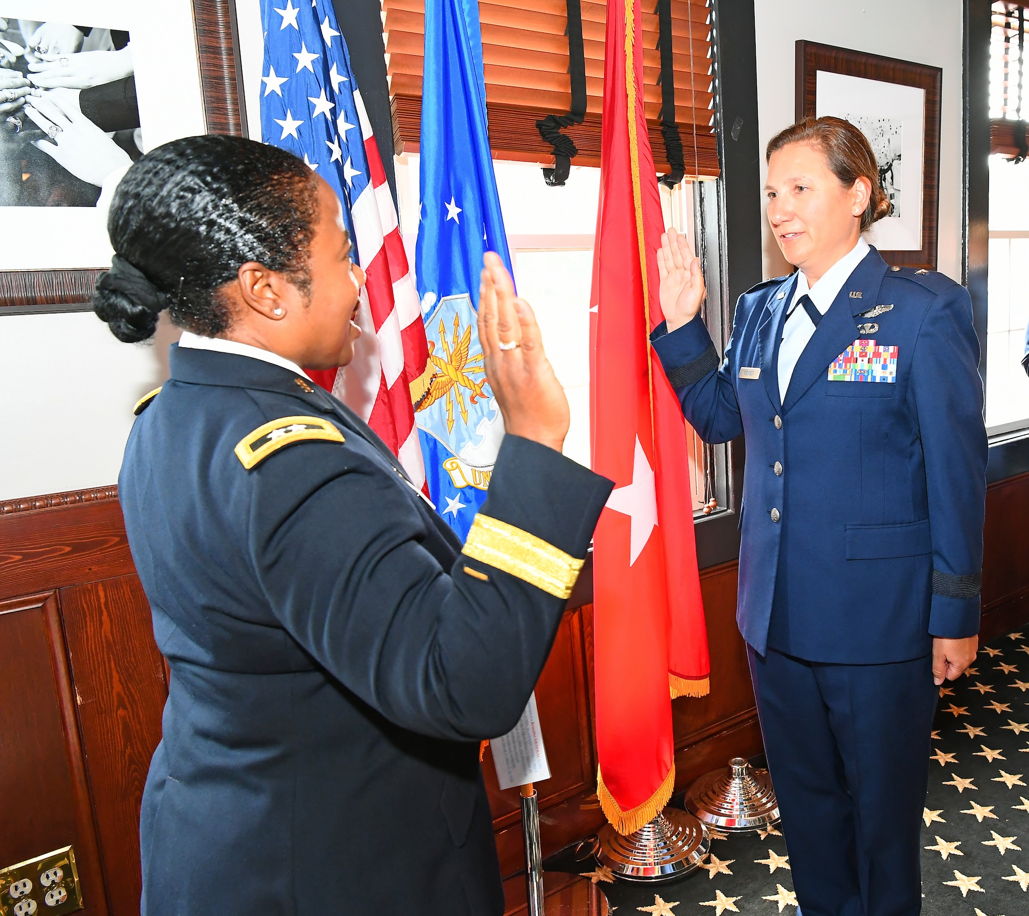 U.S. Army Maj. Gen. Janeen Birckhead (left), adjutant general for Maryland, administers the oath of office to U.S. Air Force Brig. Gen. Amy Kremser, Maryland National Guard Joint Staff director, during her promotion ceremony, July 8, 2023, in Annapolis, Maryland.
